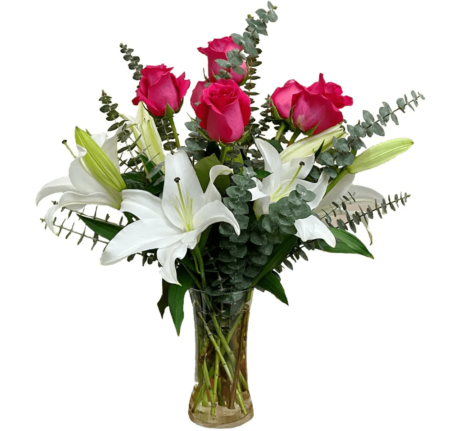 A decadent and fragrant arrangement of Casa Blanca Lilies and Pink roses. The arrangements creates an aura of romance and celebration! 