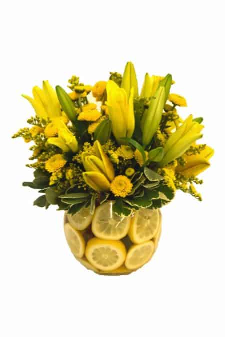 yellow lily bouquet featuring lemons
