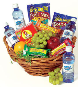 healthy gift basket with fruit, water, granola bars, and trail mix
