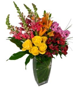yellow roses with red and pink alstroemeria in vase