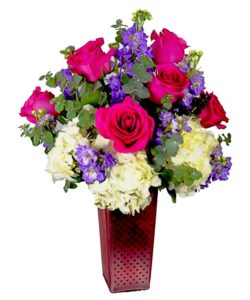 elegant design includes white hydrangea, pink, lavender or purple stock, and gorgeous pink roses. 