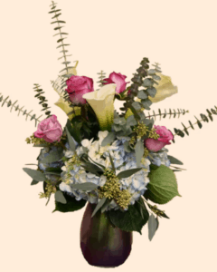 uniquely designed in a keepsake irirdescent blue and purple vase. With breathtaking blue hydrangea, white calla lilies, and purple roses. 