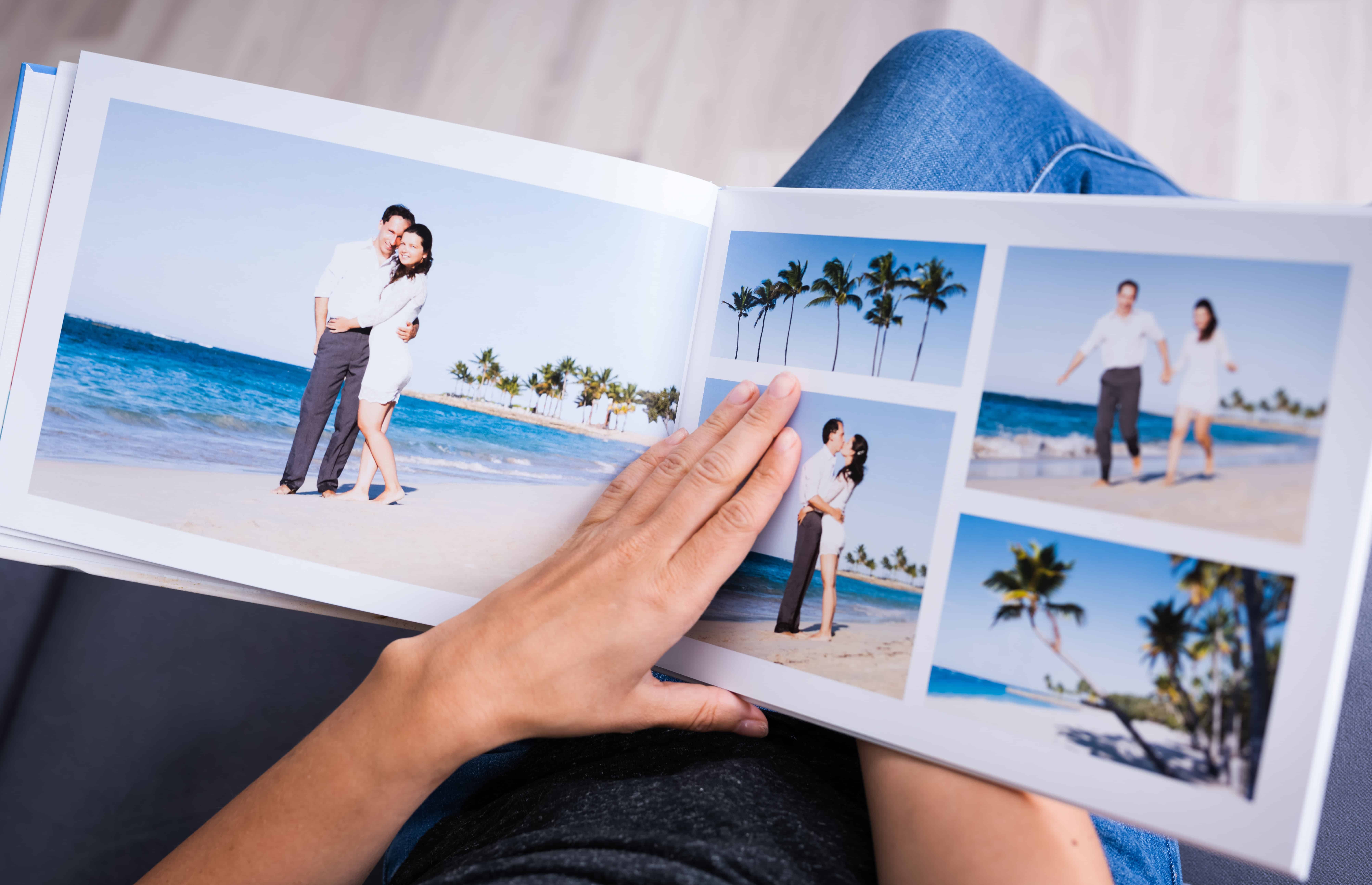Open photo book of pictures of beach